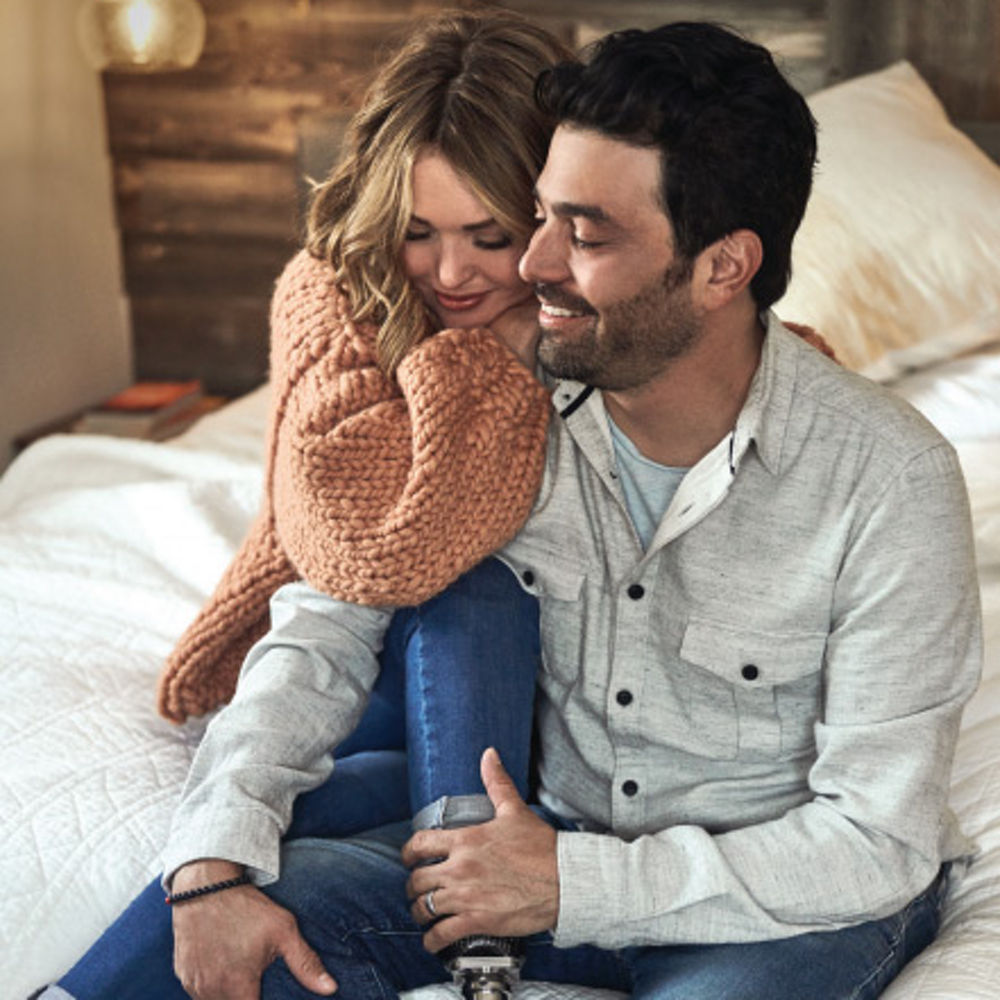 Amy Purdy and her husband posing for a picture.