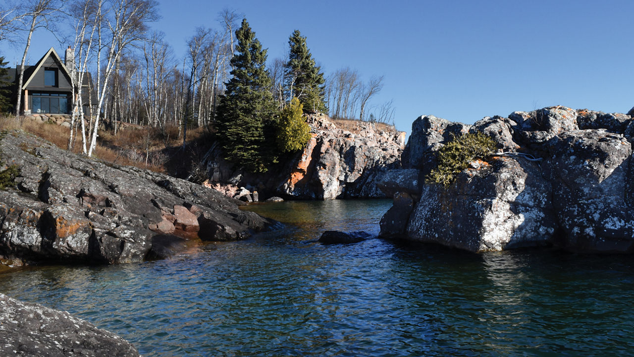 An exterior shot of a lakehome.