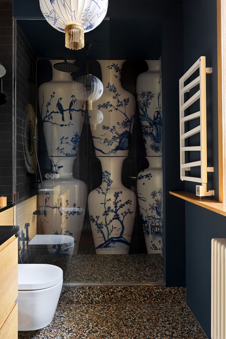A unique bathroom with several large vases as decoration in the shower.