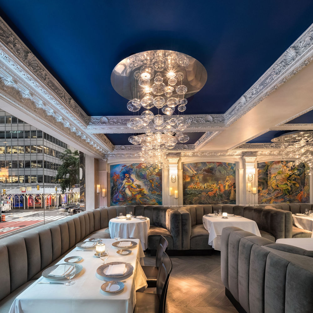 the Caviar Russe dining area, with gorgeous chandeliers, blue painted ceilings, and decedent booths.