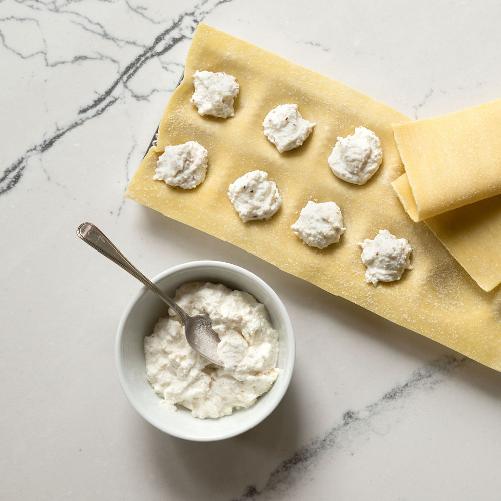 Homemade ravioli being made on top of Cambria Gladstone™ quartz countertops.