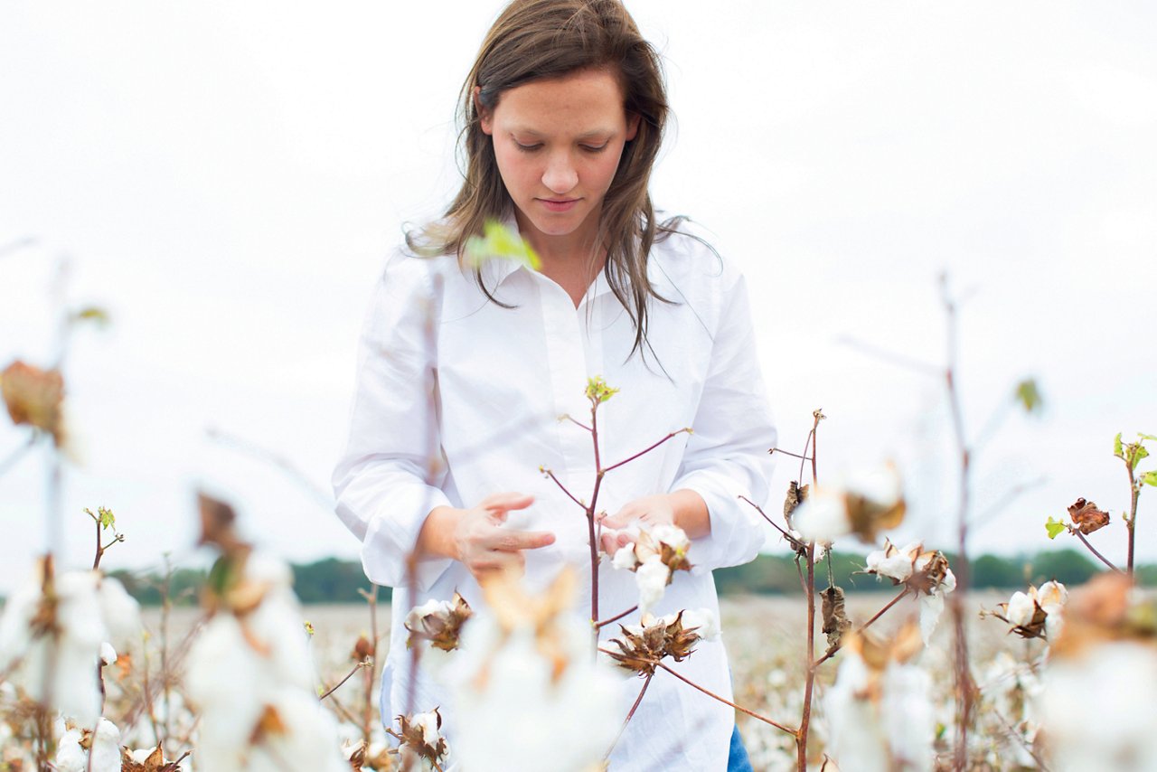 A woman picking cotton. 