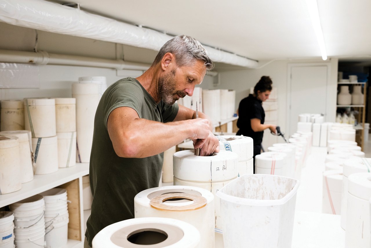 A man creating a piece of craftsmanship.