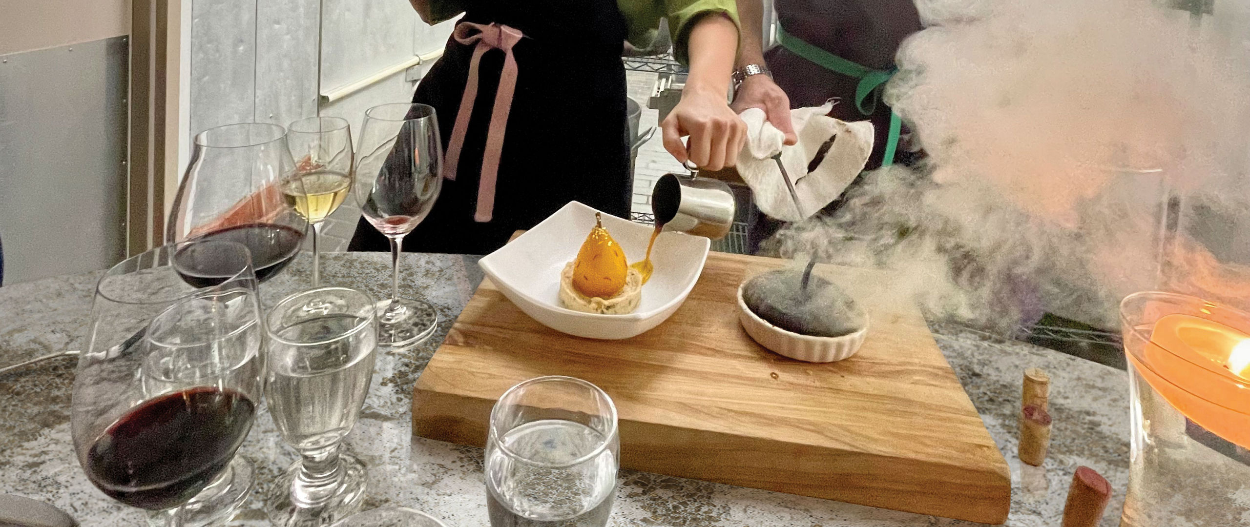 2 people cooking in a kitchen with Cambria quartz countertops.