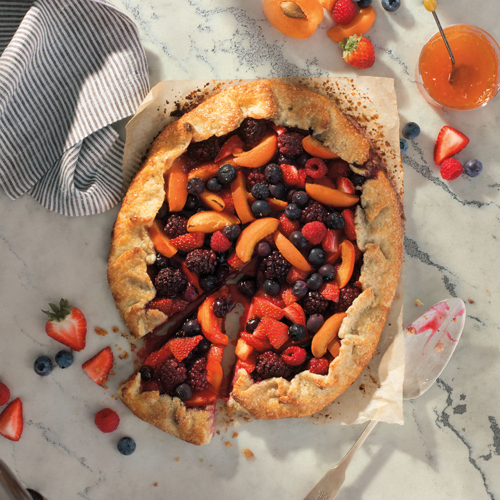 A delicious, vibrantly colored Mixed Fruit Galette sitting atop a Cambria Berkshire Steel Sculpted quartz countertop