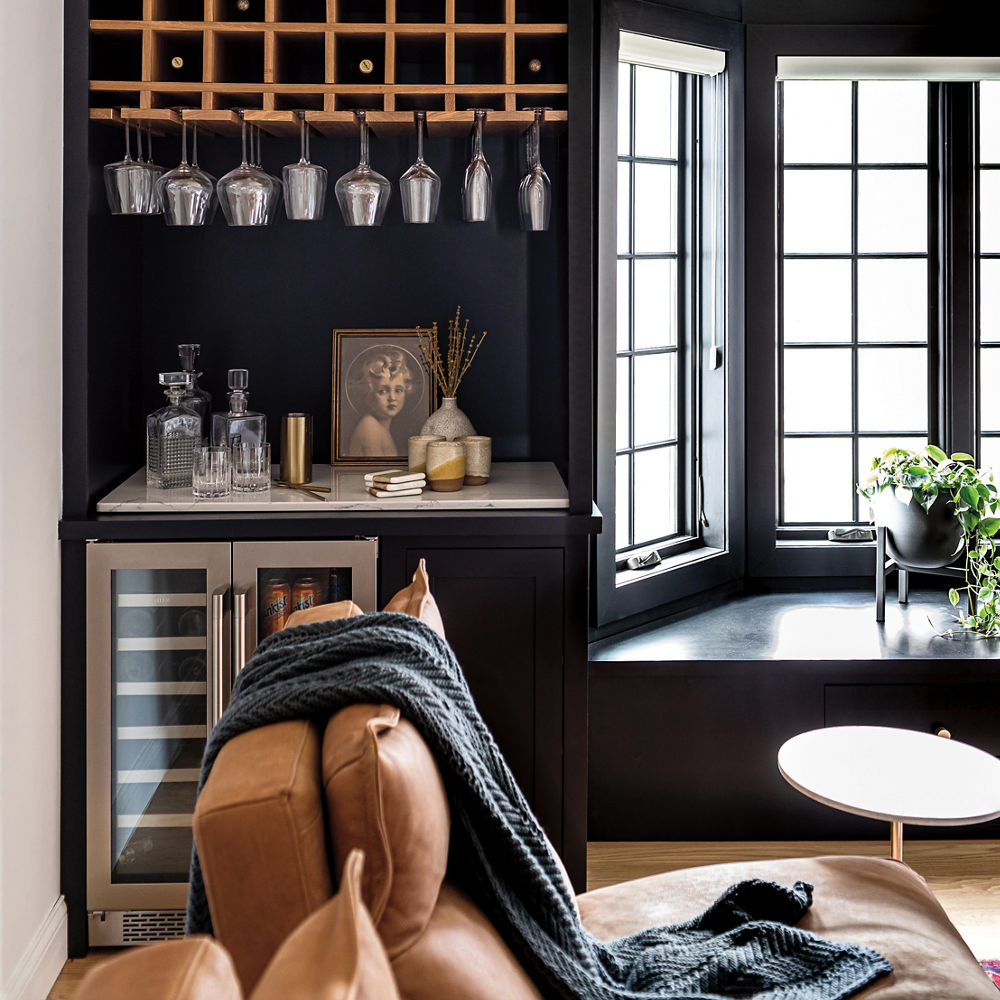 A living room with a built in bar with Ella quartz countertops