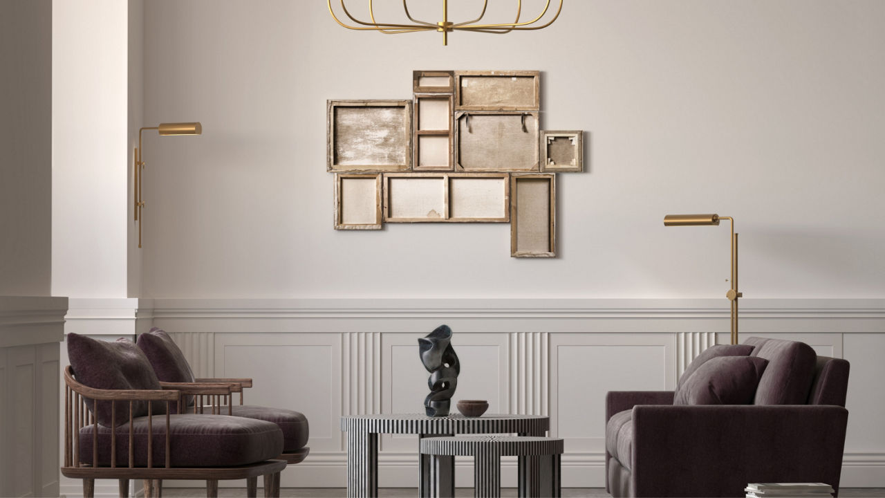 Living room with two chairs, a couch, and a table below a Lepanto Chandelier by Currey & Company.