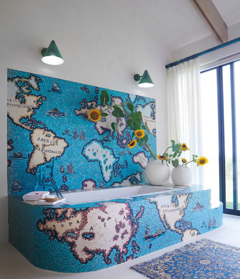 A multi-colored map covering a tub in a bedroom.