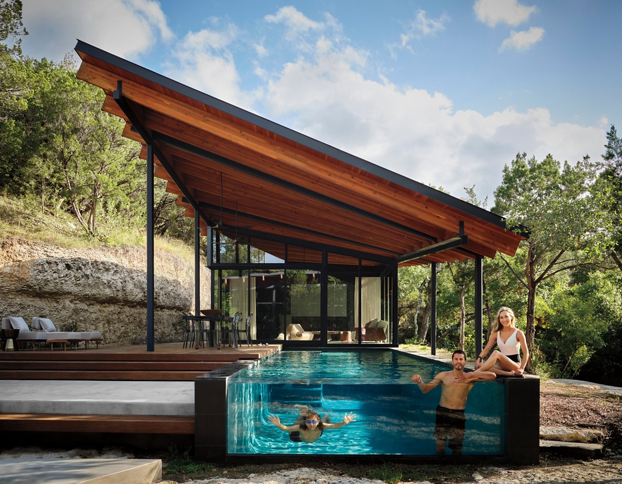 Designer and homeowner Mary Mandel, her husband Jaime Delgado, and their son Drake, enjoy the pool