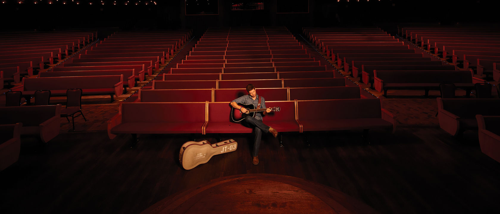 Josh Turner playing his guitar at the Grand Ole Opry.