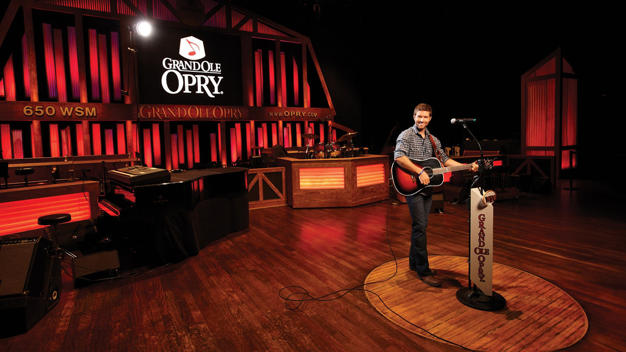 Josh Turner playing his guitar at the Grand Ole Opry.