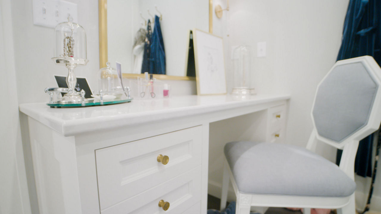 Walk-in closet vanity featuring a Cambria Delgatie quartz countertop.