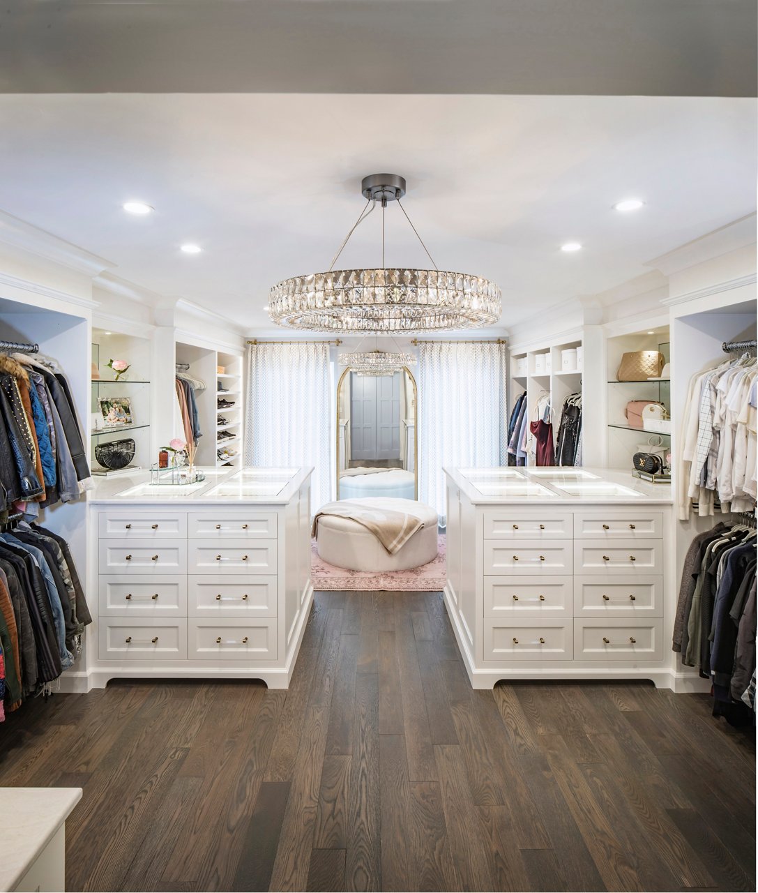 A closet with double islands featuring Cambria Delgtie quartz countertops.