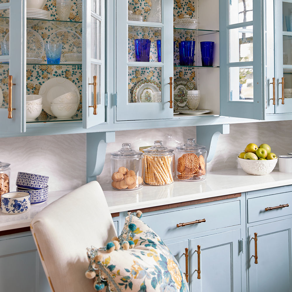 Dining room featuring blue shelves and Cambria Delgatie quartz countertops.