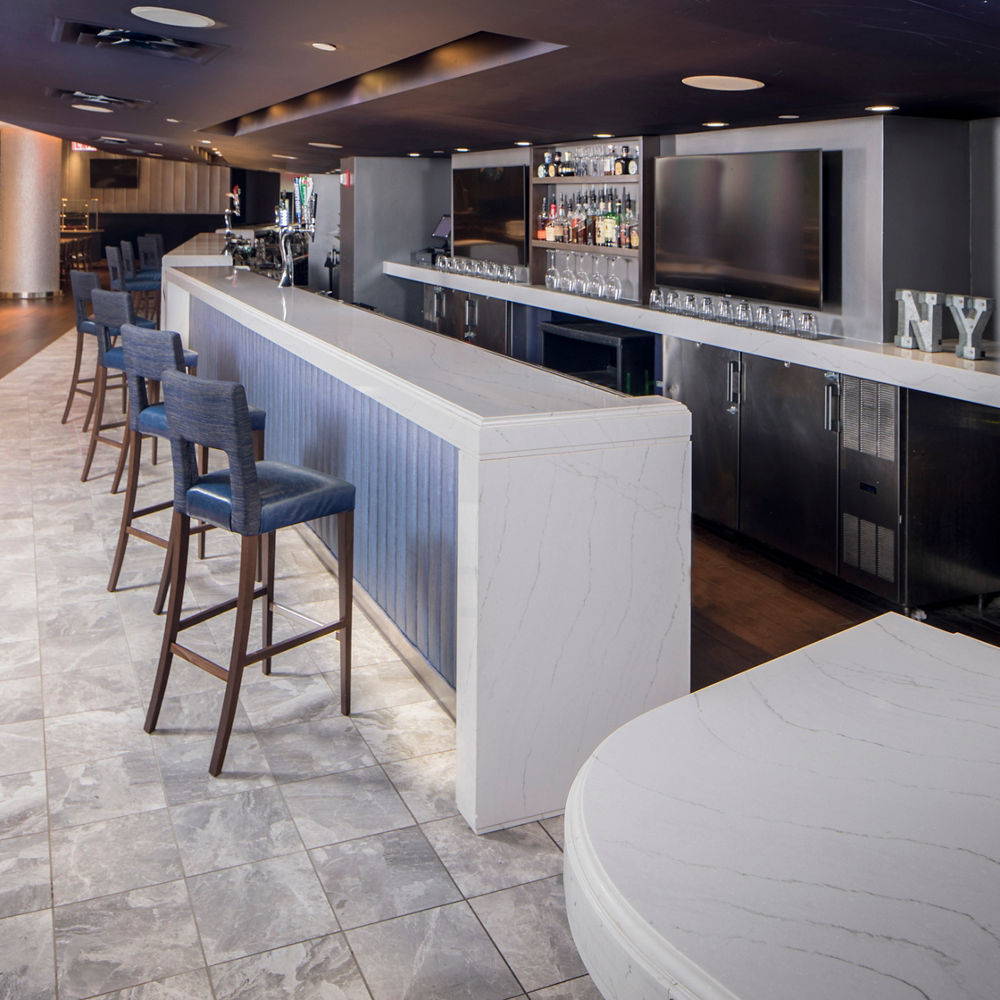 A bar with Ella quartz countertops at the Yankees Legends Suite Club