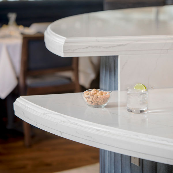 This bar in Yankee Stadium’s Legends Suite featuring quartz countertops with an ornate custom edge.