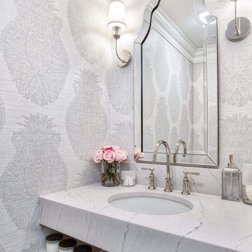 A grey themed bathroom accented by a Cambria Ella quartz countertop sink