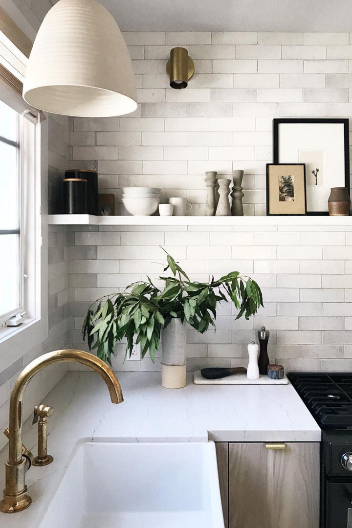 Corner of kitchen featuring a Cambria Ella Matte quartz countertop and black matte accessories.