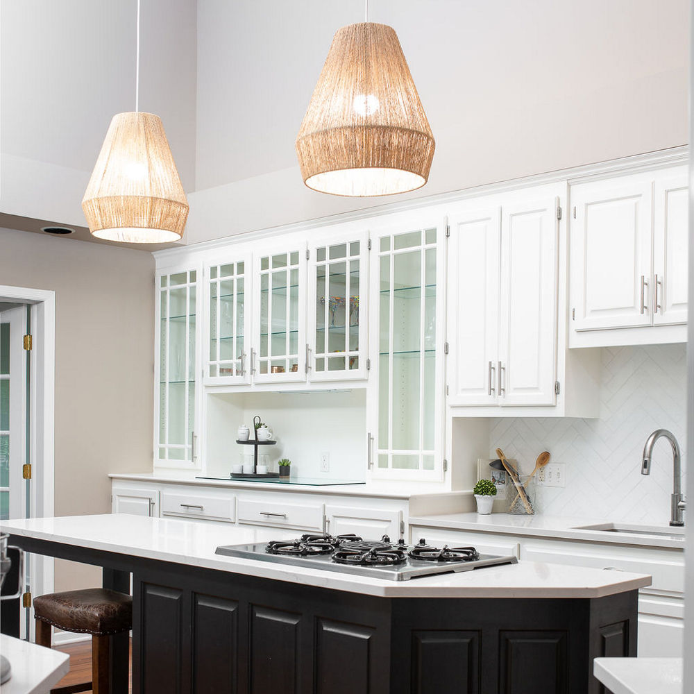 Kitchen with a dark oak island and white cabinets with Ella quartz countertops