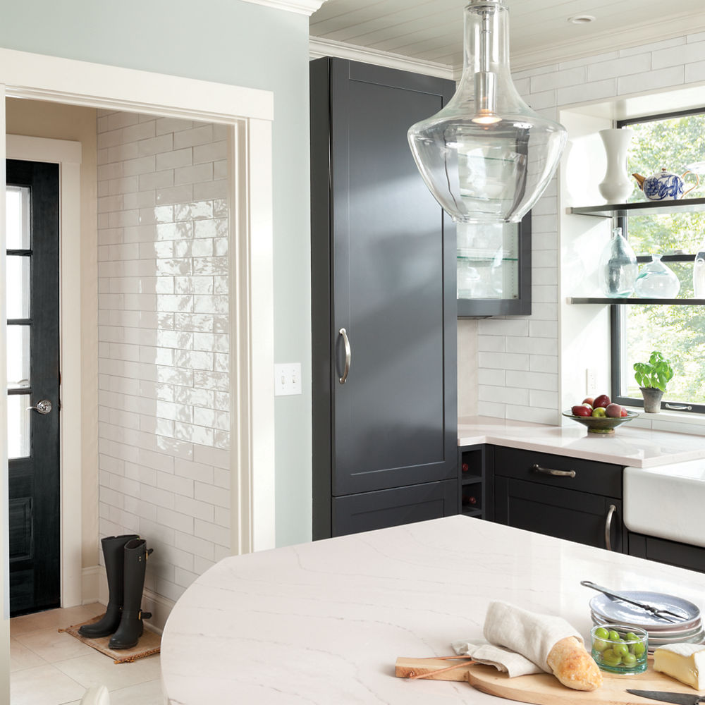 A rounded Ella™ kitchen island offers the appeal of a luxe tabletop in this modern farmhouse kitchen