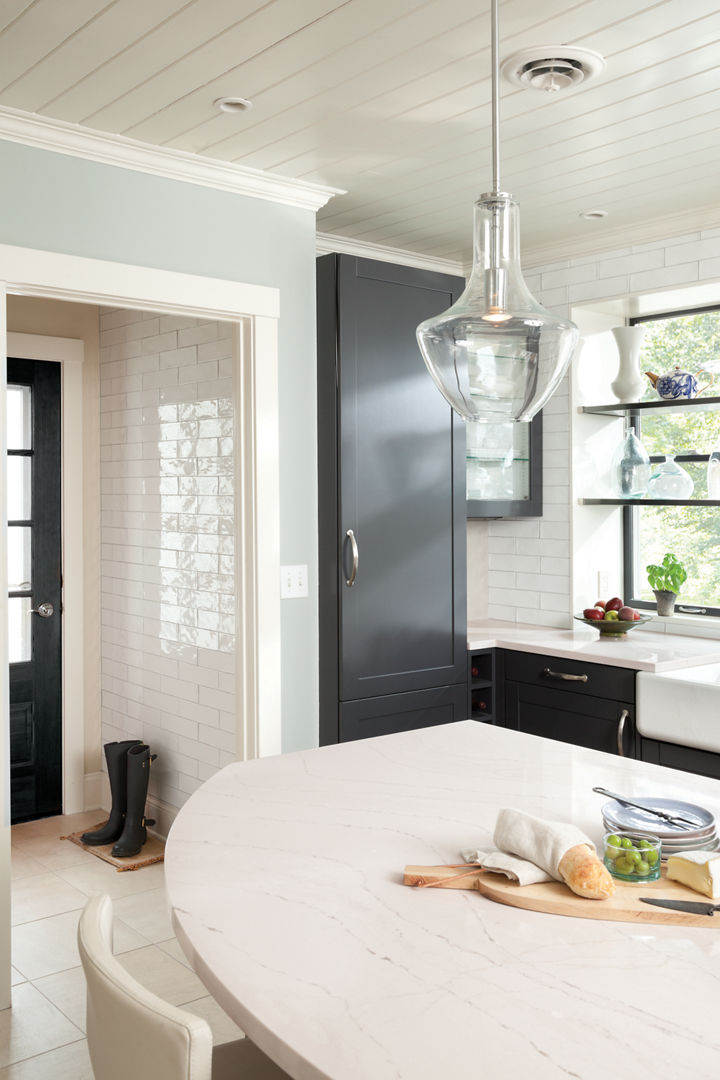A rounded Ella™ kitchen island offers the appeal of a luxe tabletop in this modern farmhouse kitchen