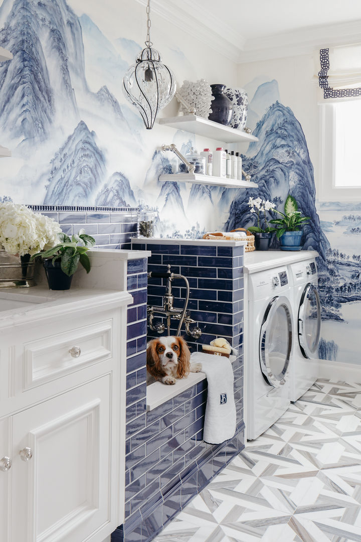 Cambria Ella quartz laundry room with white countertops and a blue-tiled pet shower.