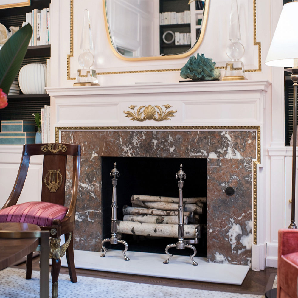A fireplace featuring Cambria Ella white quartz. 