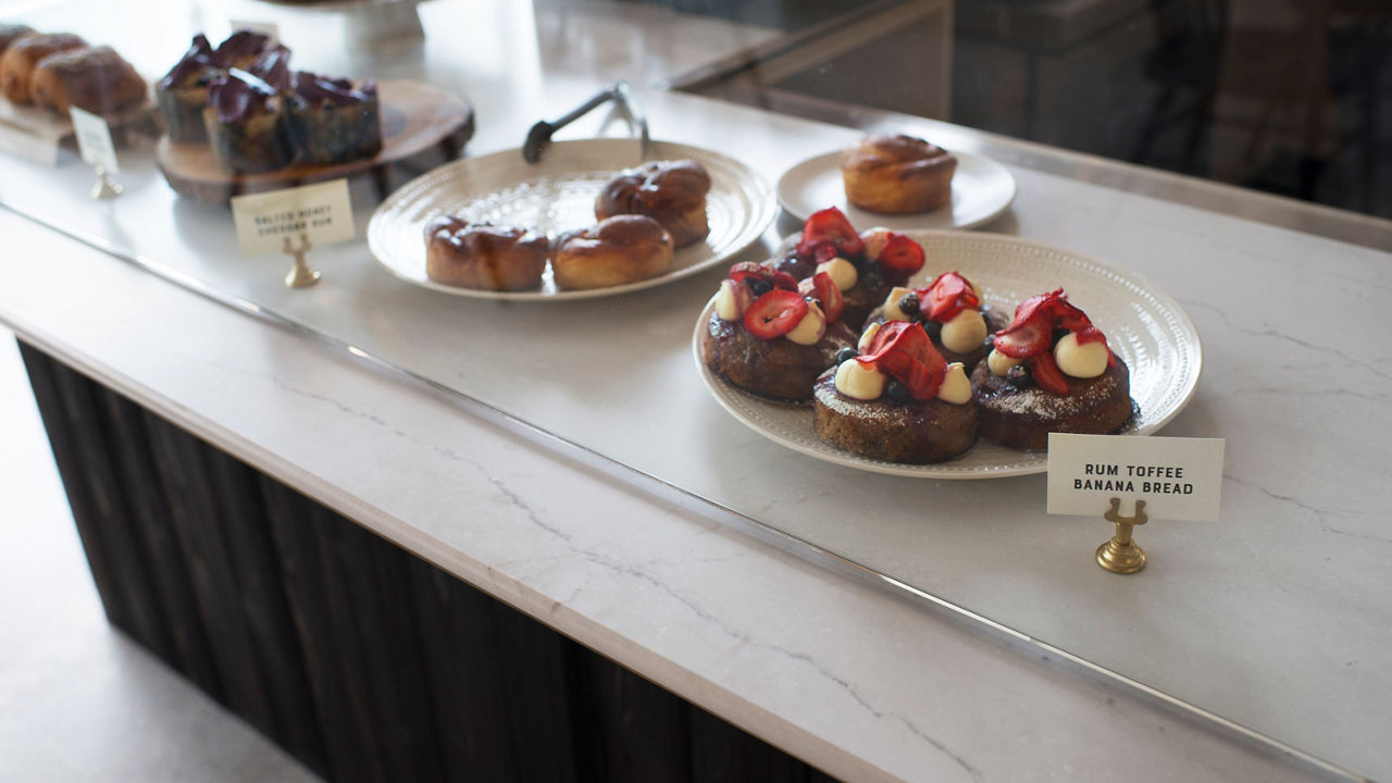 A desert display case featuring a counter with Cambria Ella Matte quartz.