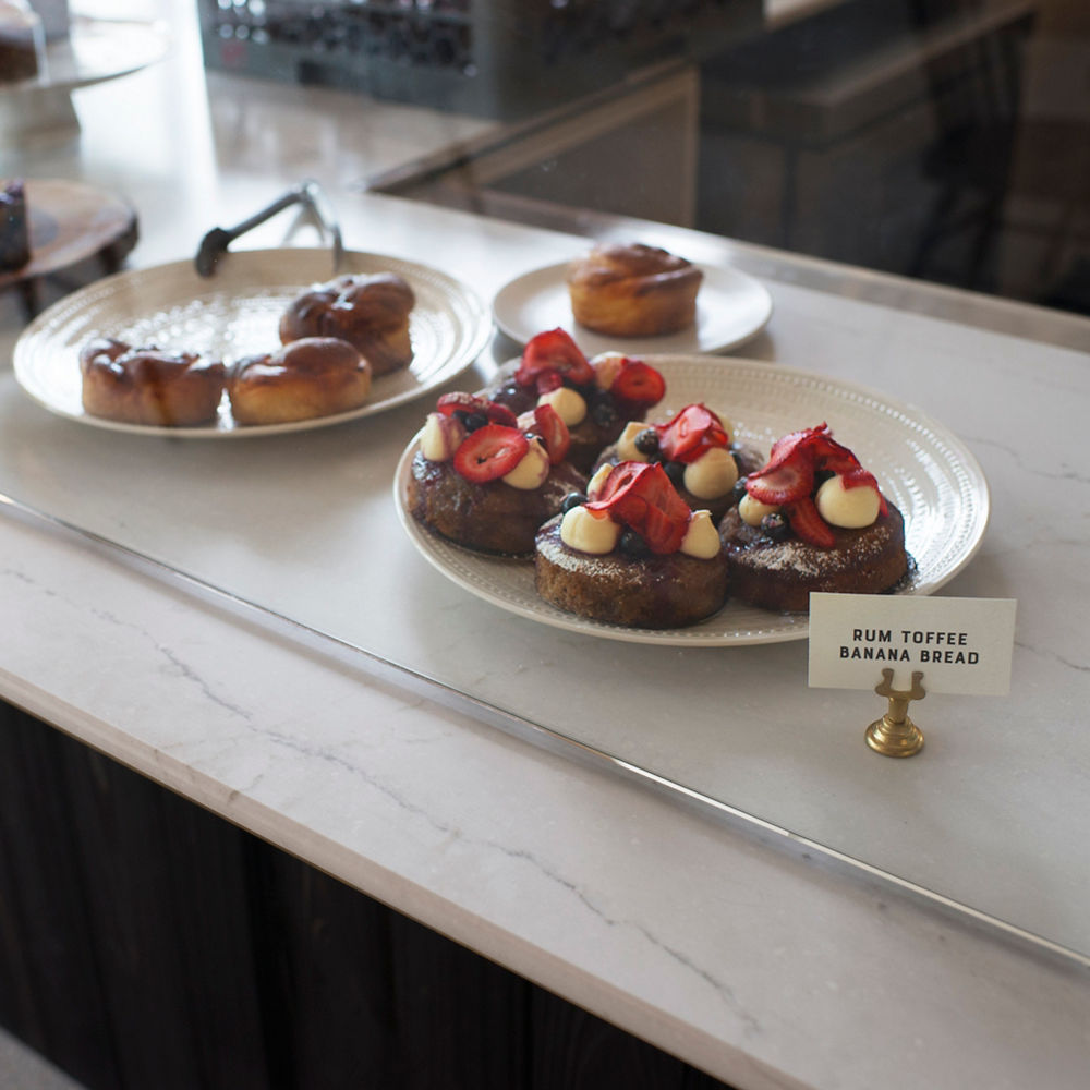 A desert display case featuring a counter with Cambria Ella Matte quartz.