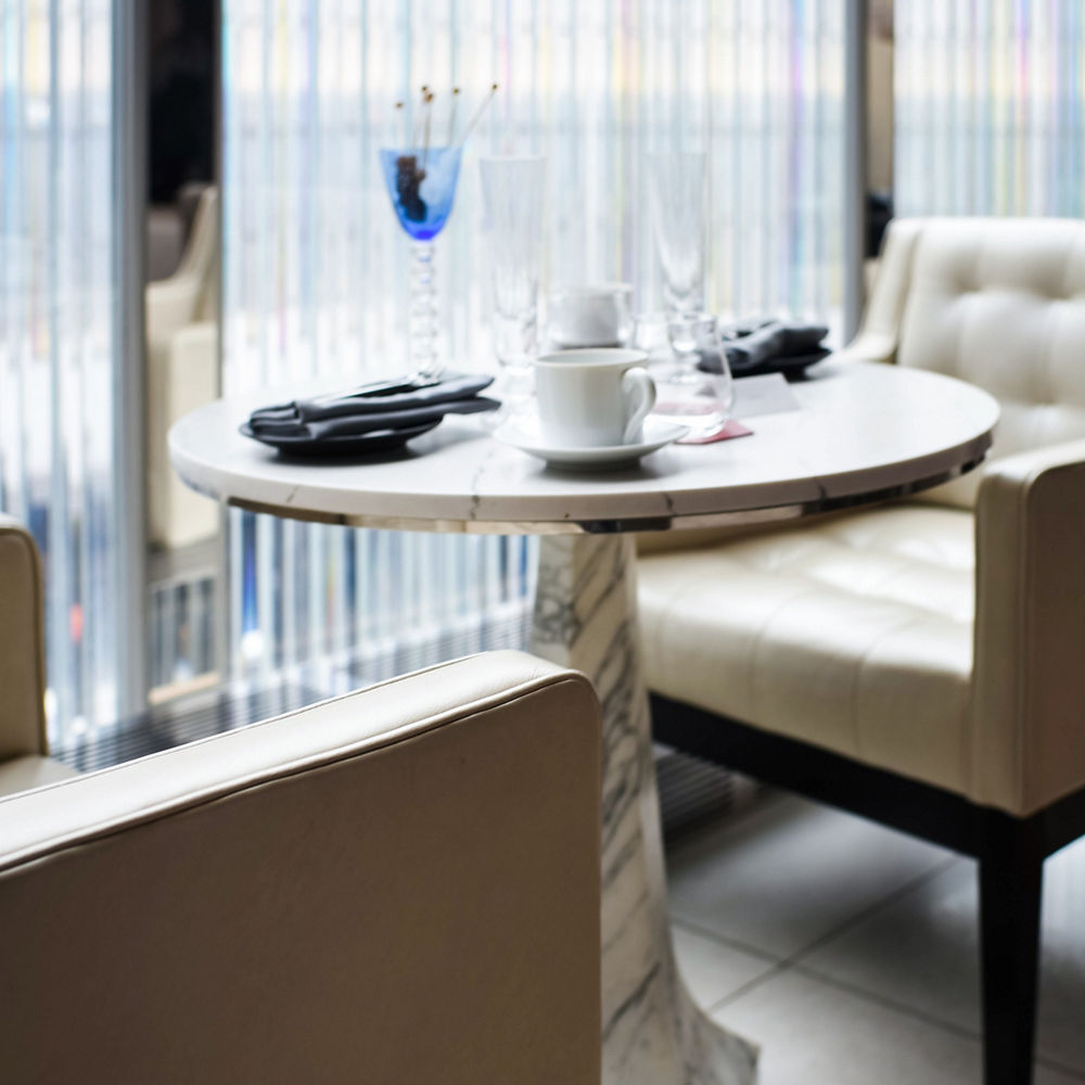 A restaurant at the Baccarat Hotel with an Ella quartz tabletop