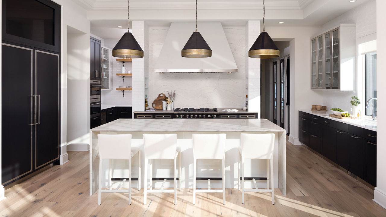 White and black kitchen featuring Cambria Ella quartz countertops