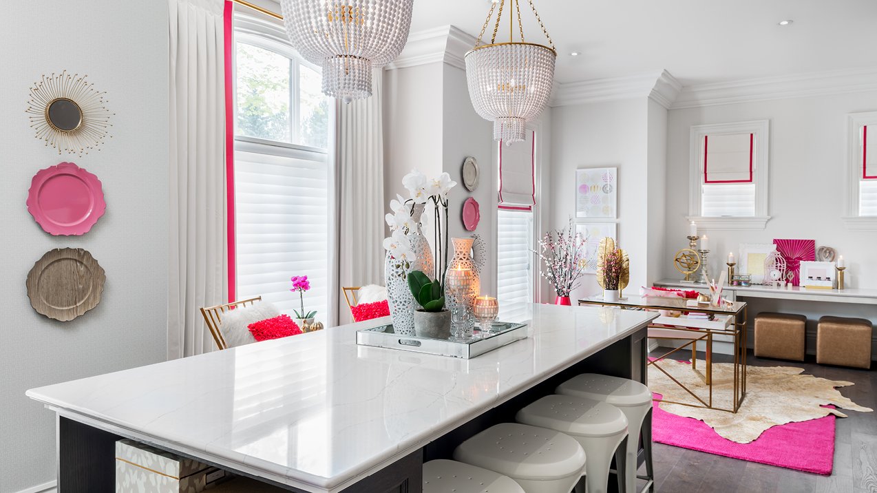 A stylish modern workspace with chandeliers and Cambria Ella quartz countertop