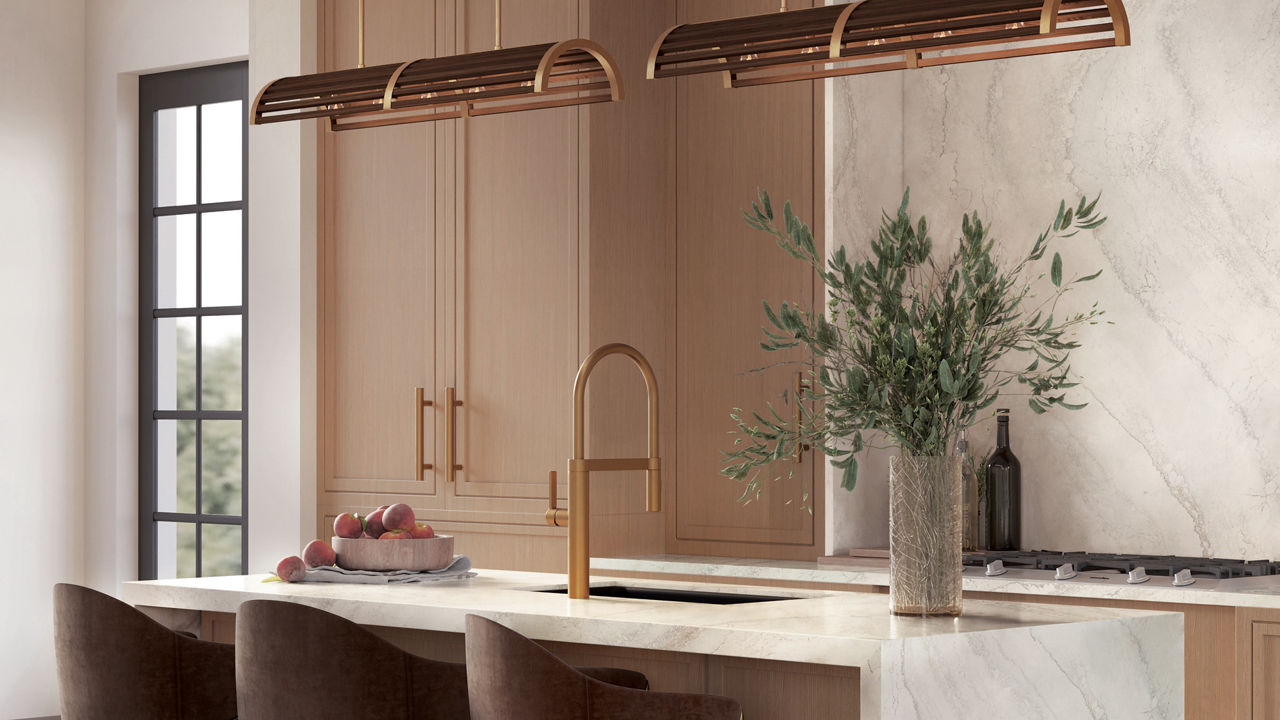 Oak kitchen with gold fixtures and Everleigh quartz waterfall countertop and backsplash