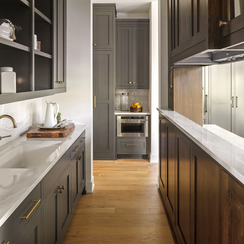 everleigh quartz kitchen island with backsplash and dark cabinetry