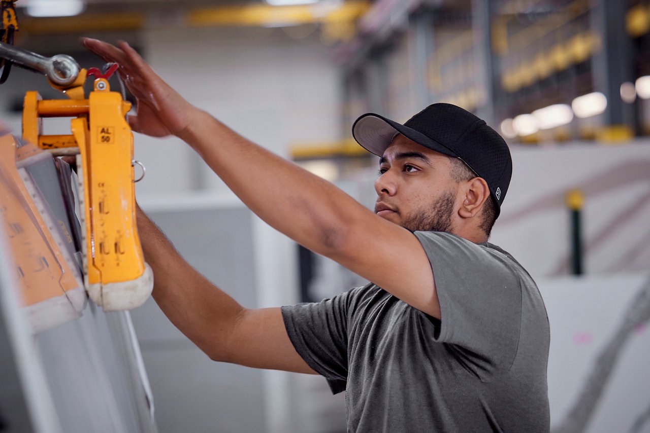 A fabricator working on a quartz slab