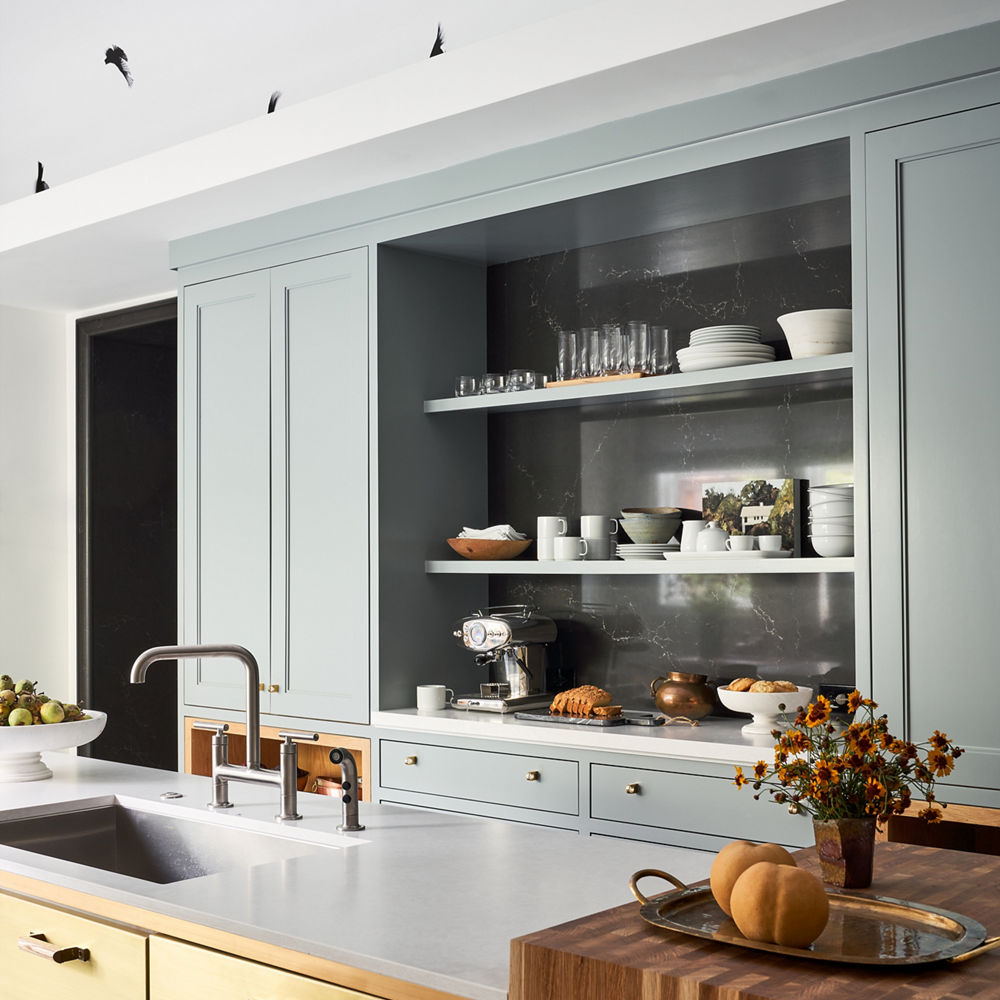 Kitchen with teal cabinets and Foggy City Matte and Charlestown quartz countertops