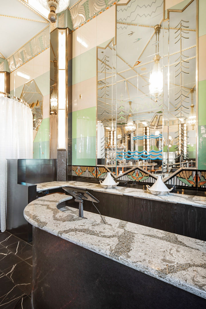 a restaurant reception area topped with gray and white veined quartz countertops.