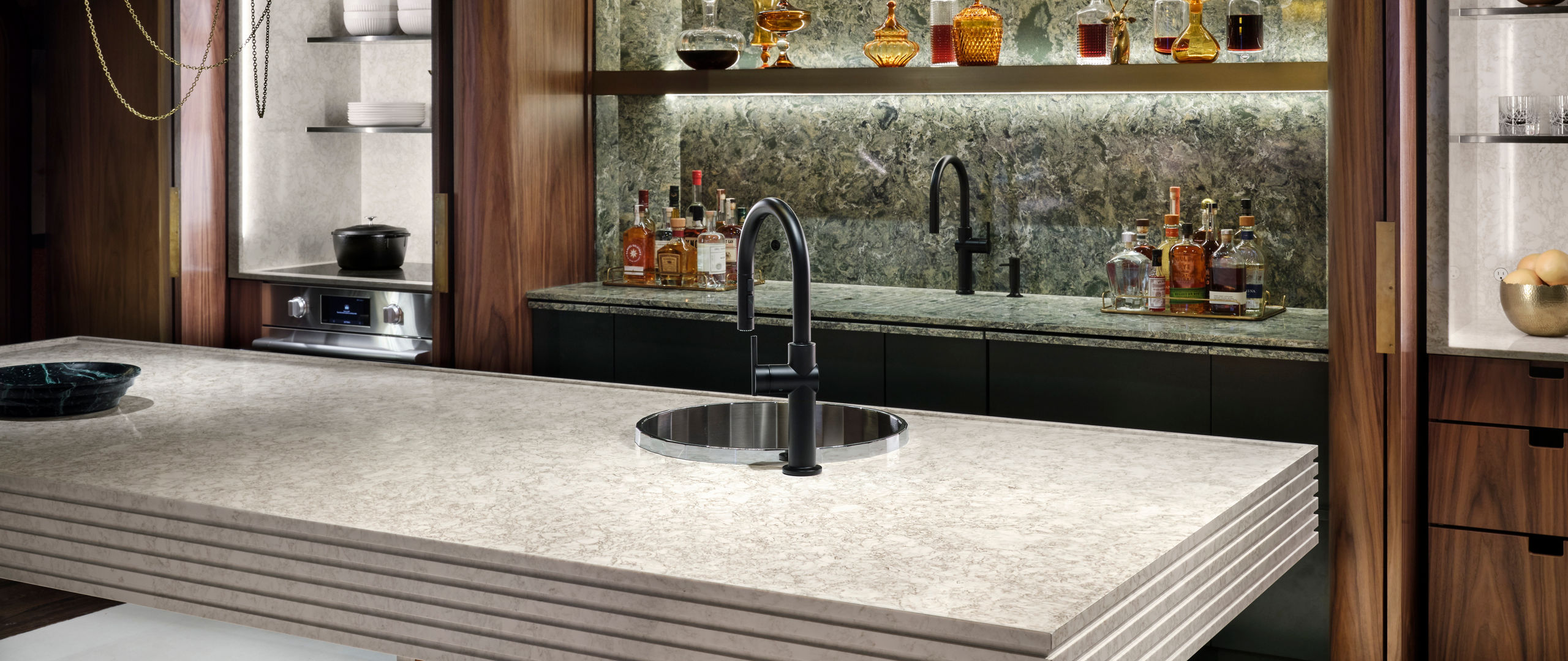 Unique Cambria Hermitage and Wentwood quartz bar countertop and backsplash