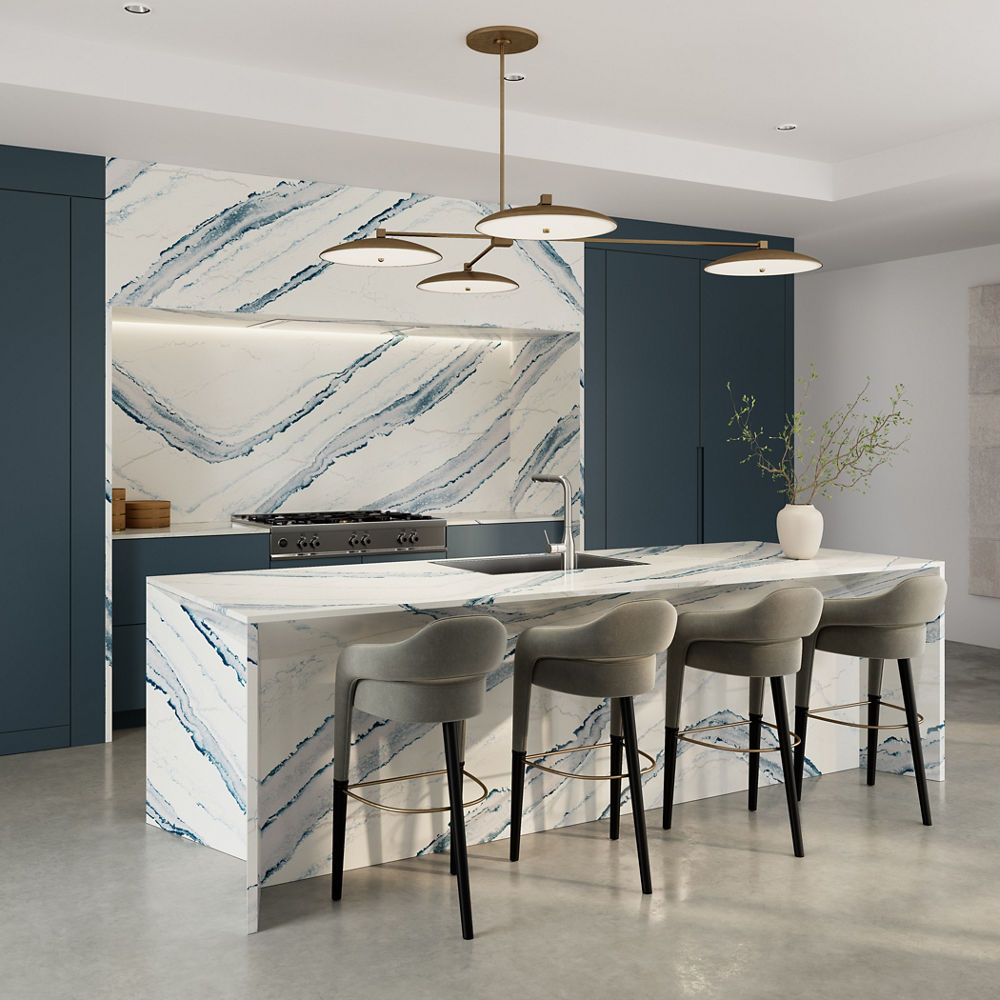 Kitchen featuring a wall, counter, and island with Cambria Inverness Bristol Bay quartz countertops and siding.