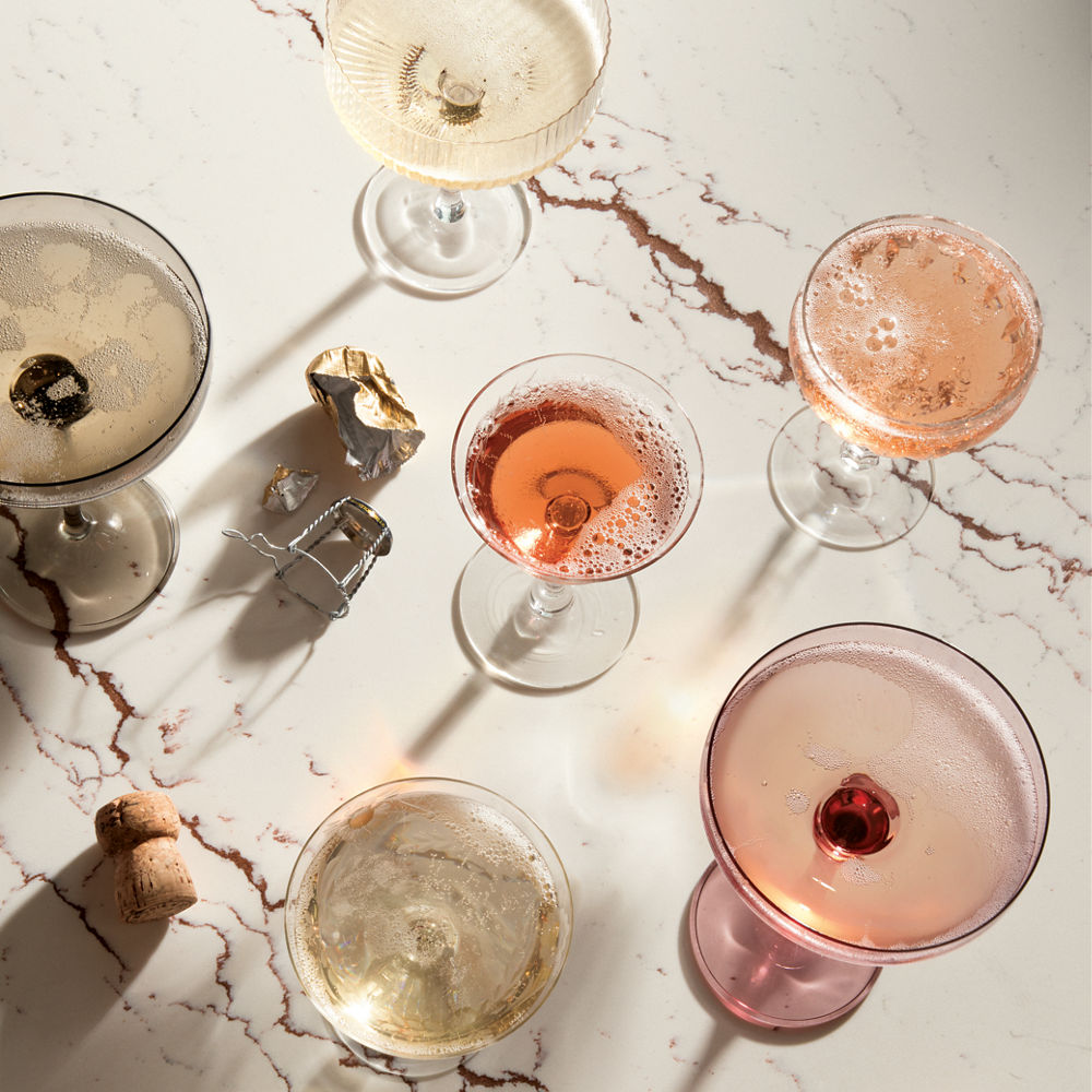 Top-down view of various drinks on top of a Cambria Inverness Bronze Matte quartz countertop.