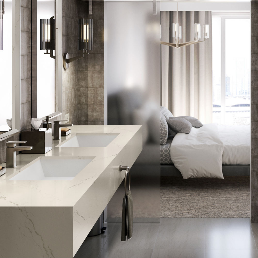 A majestic bathroom with a Cambria Inverness Frost countertops and tub surround