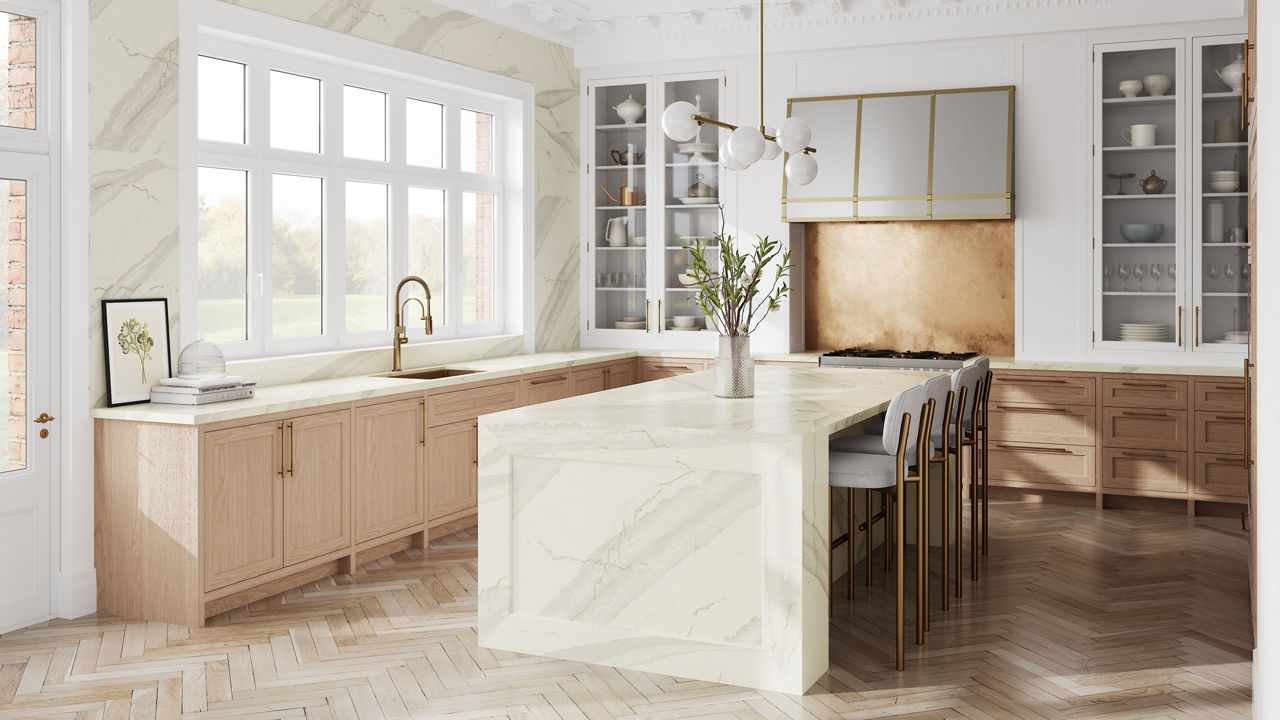 A bright white kitchen with an Inverness Swansea quartz waterfall island countertop
