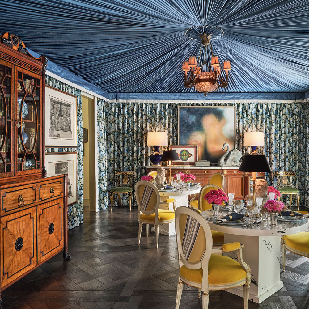 A colorfully, ornate dining room with a Cambria Ivybridge quartz surround tables