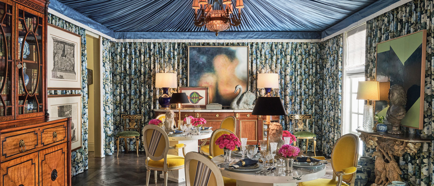 A colorfully, ornate dining room with a Cambria Ivybridge quartz surround tables