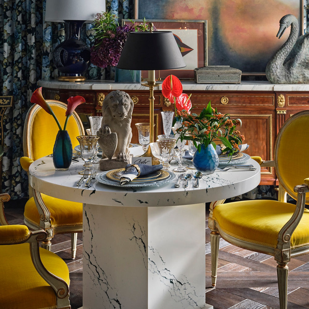 A colorfully, ornate dining room with a Cambria Ivybridge quartz surround table