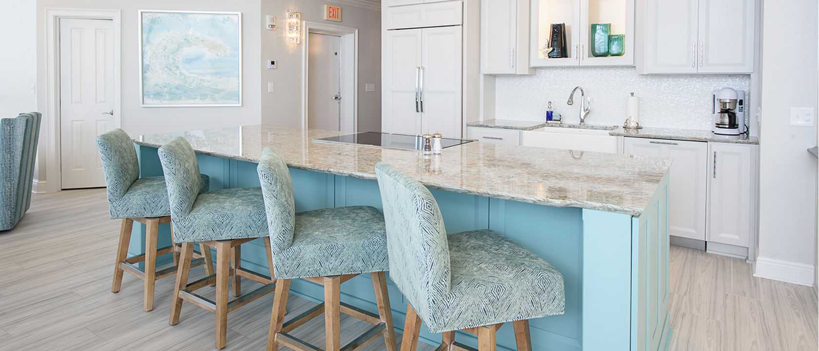 White kitchen featuring island with Cambria Kelvingrove quartz countertops.