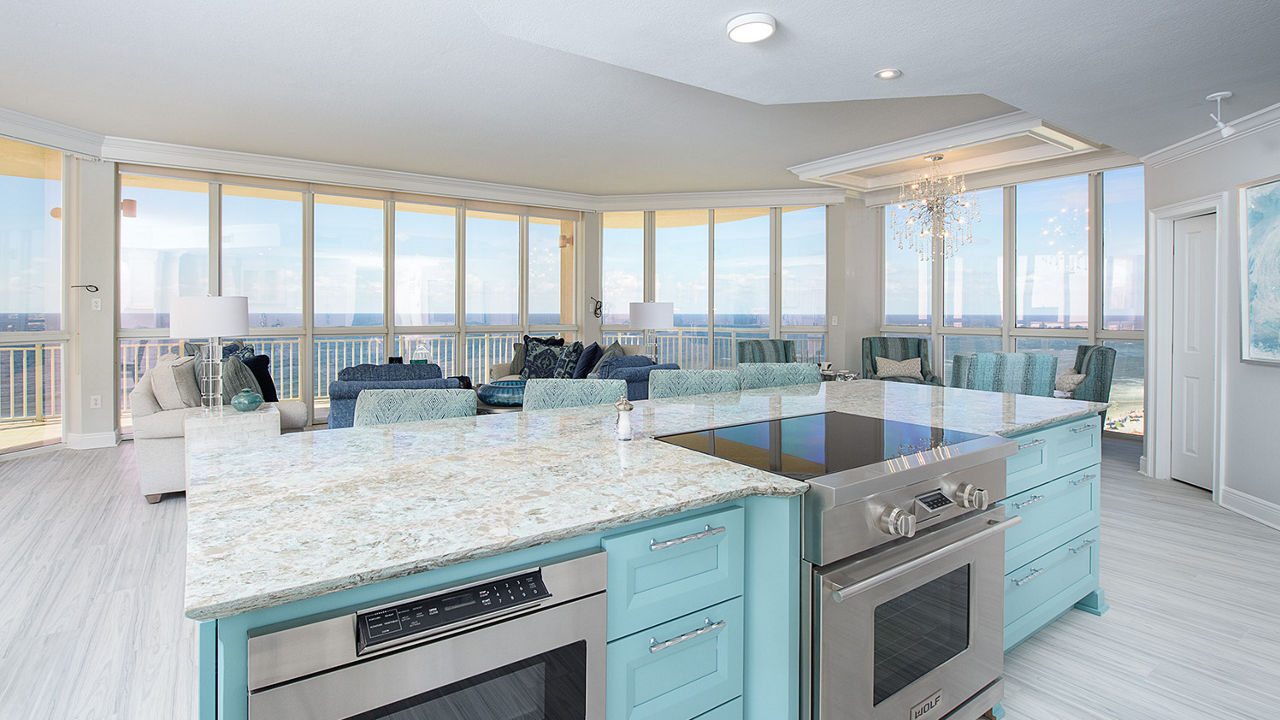 Turquoise kitchen island with Kelvingrove countertops.