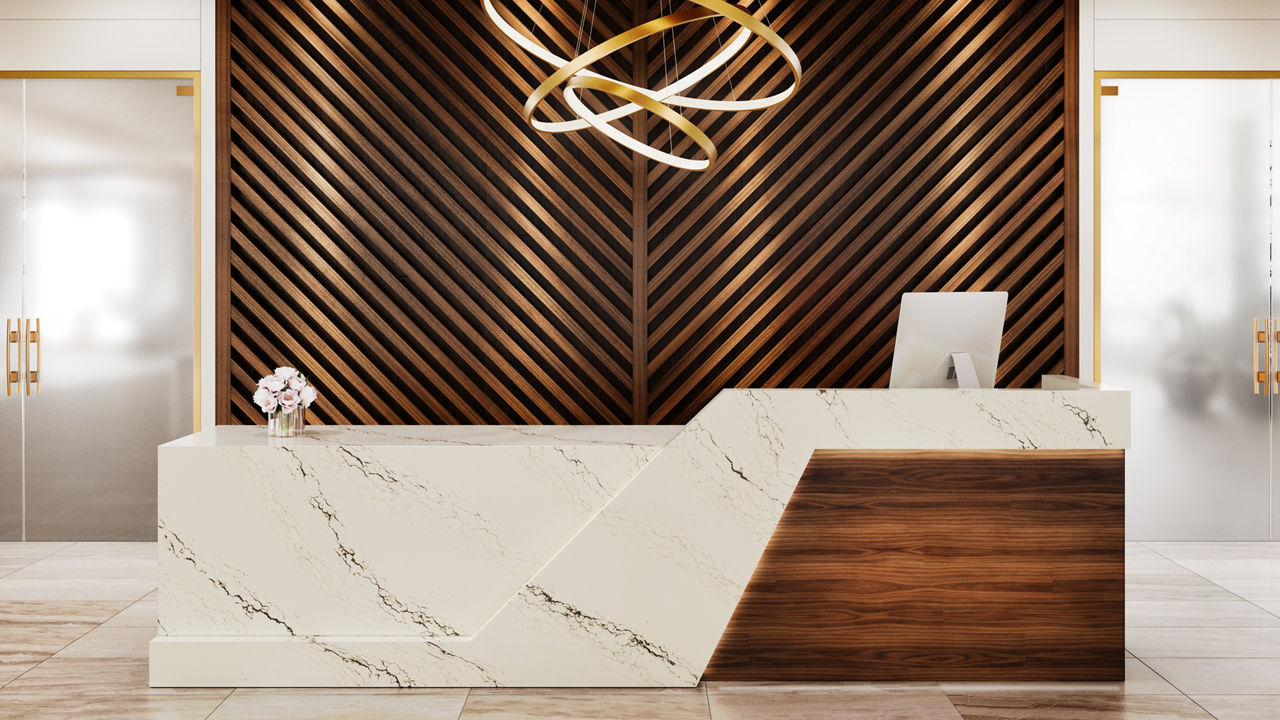 A lobby with a reception desk covered in Notting Hill quartz