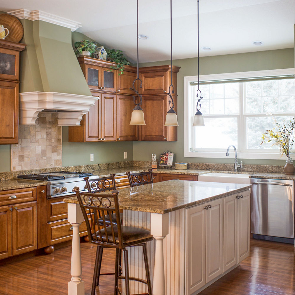 An outdated kitchen with brown countertops that are low-performance