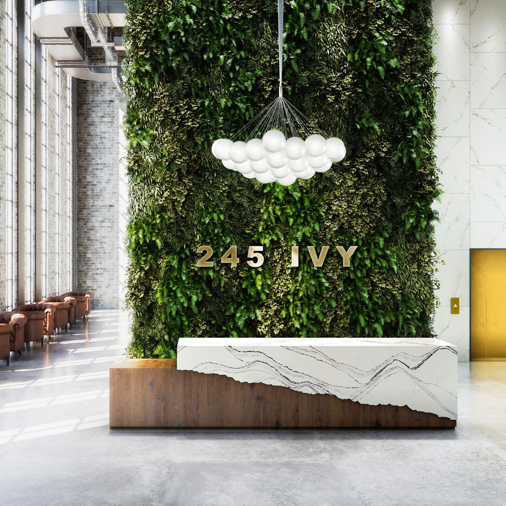 Cambria Portrush quartz waterfall reception desk in lobby area.